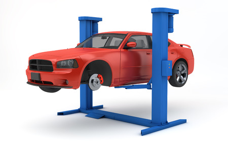 car lifted up on lift isolated on whiteの写真素材