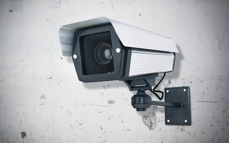 Surveillance Camera on concrete wallの写真素材