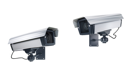 Surveillance Cameras watching each other on white background. clipping pathの写真素材