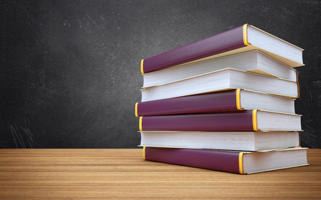 Stack of books on wooden tableの写真素材