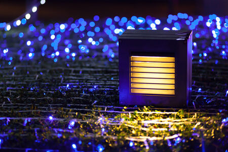 lighr blub and abstract blue bokeh ball background