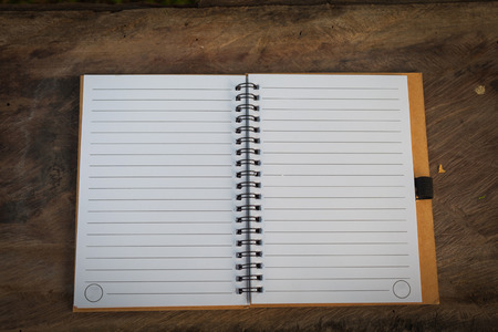 two blank page notebook on wood texture, vignette effectの写真素材