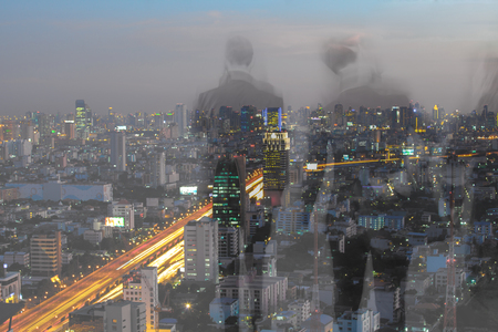 motion blur business people with cityscape backgroundの写真素材