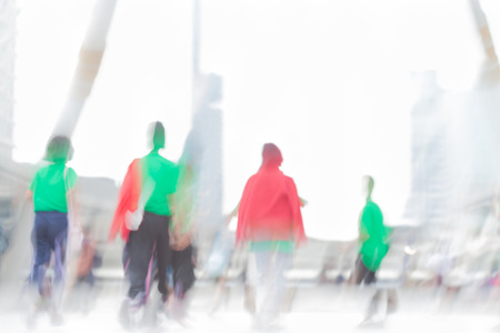 motion blue people in green and red shirtの写真素材