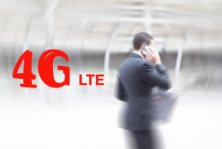 motion blur businessman holding document and mobile phone. Mobile Telecomunication concept