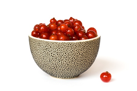 Detail of redcurrants in the small bowl isolated on the white backgroundの写真素材