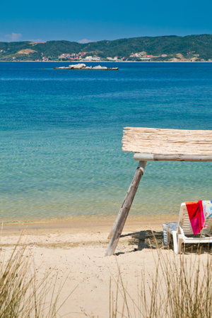 Sun chair with roof on a coral beachの写真素材