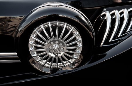 Black retro car spare wheel. Side view.の写真素材