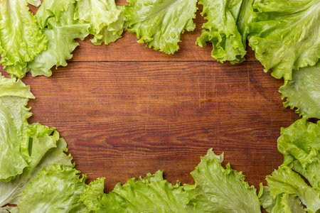 Frame of salad on old wooden tableの写真素材