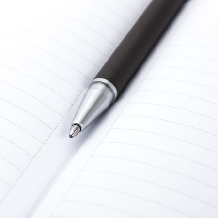 Ball pen and office pad, focus on the pen tipの写真素材