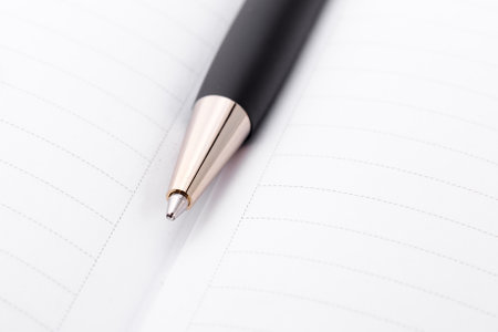 Ball pen and office pad, focus on the pen tipの写真素材