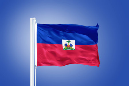 Flag of Haiti flying against a blue sky.の写真素材