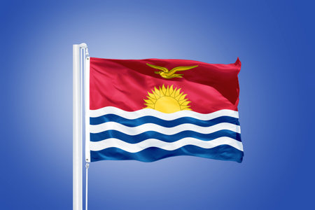 Flag of Kiribati flying against a blue sky.の写真素材