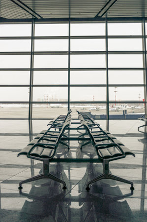 airport waiting area, seats and window