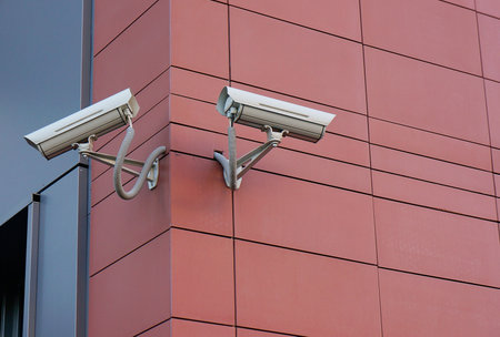 Two security cameras on building