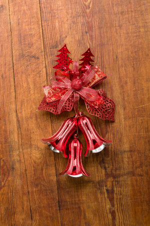 Christmas bells on wooden background.の写真素材