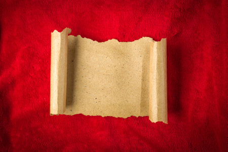 Christmas vintage scroll on red background.の写真素材