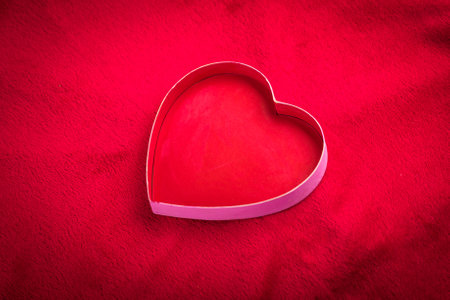 heart with a blank card on red background.の写真素材