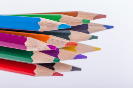 Many different colored pencils on white background.の写真素材