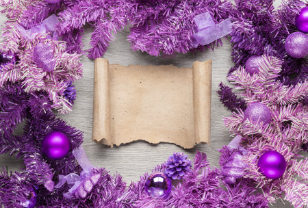 Magenta christmas wreath with parchment decorations on wood background.の写真素材