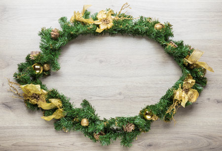 Christmas fir tree on wooden board background.の写真素材