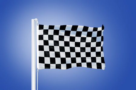 Finish flag flying in a stiff breeze against clear blue sky.の写真素材