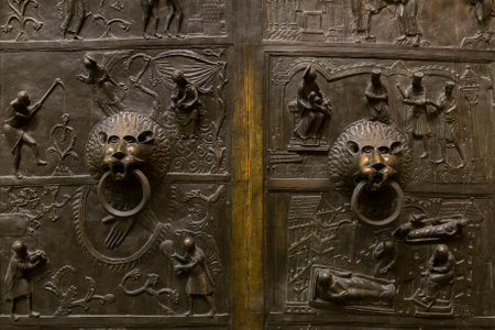 Lion head knocker on old metal gate.の写真素材