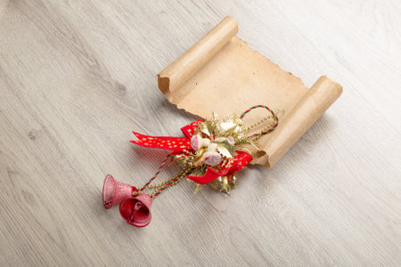 Christmas card on wooden top with christmas ornaments.