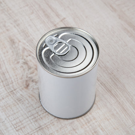 tin can on white wood background.
