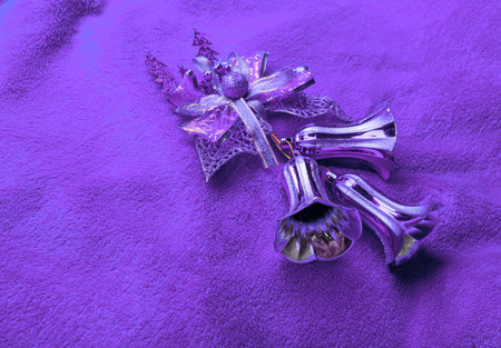 Xmas bells on violet background.