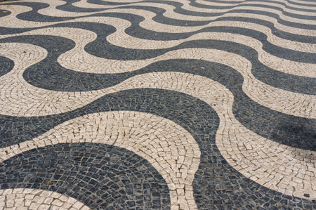 Typical portuguese cobblestone pavement on the street of Lisbon, Portugalの写真素材
