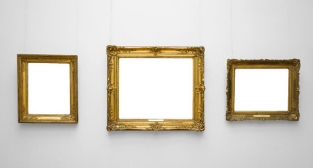 Three gold empty frame on white wall.の写真素材