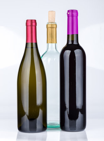 Three wine bottles isolated on white background.の写真素材