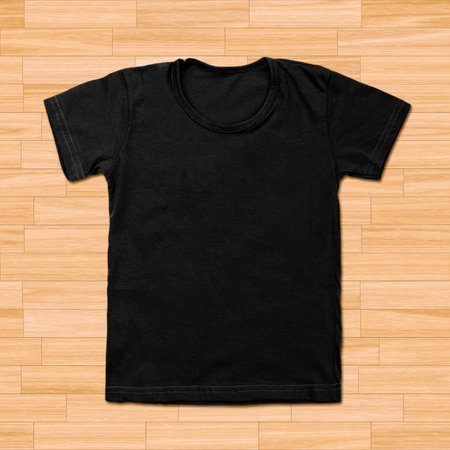 Black blank t-shirt on wooden background.の写真素材