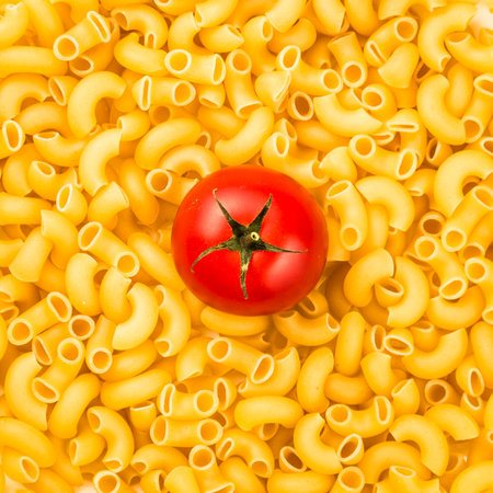 Pasta texture background with tomato Traditional Italian food.の写真素材