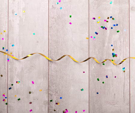 Wooden board with colorful streamers.の写真素材