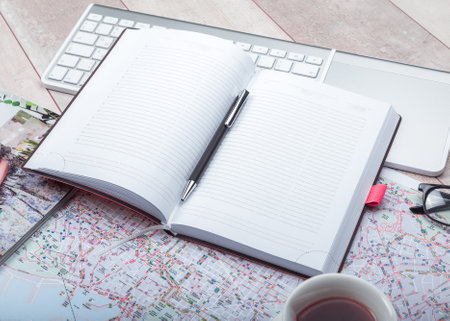 Diary notepad with accessories on table.