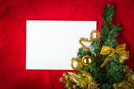 Christmas blank card made of white paper on red.