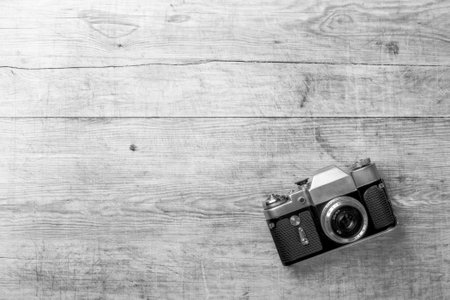 top view of retro camera on wooden tableの写真素材