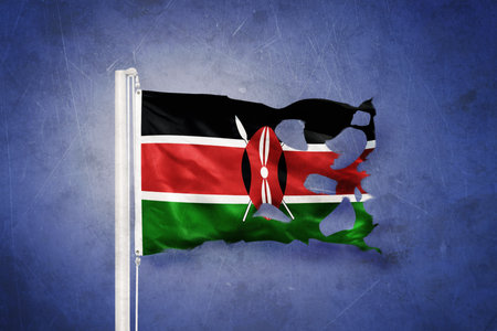 Torn flag of Kenya flying against grunge backgroundの写真素材