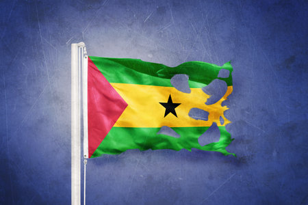 Torn flag of Sao Tome and Principe against grunge backgroundの写真素材