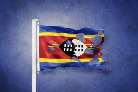 Torn flag of Swaziland flying against grunge backgroundの写真素材