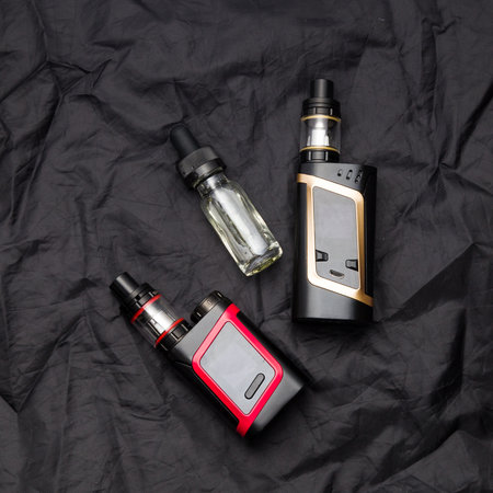 Vaping electronic mech mod and vape liquid.の写真素材