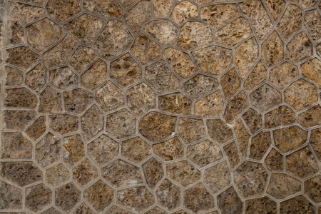 Stone pavement texture. Granite cobble stoned pavement background. Abstract background of old cobblestone pavement close-upの写真素材