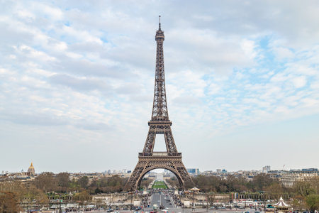 Eiffel tower against cloudy skyの写真素材