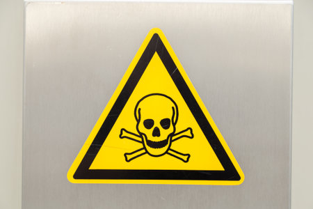 Yellow Warning Sign with Skullの写真素材