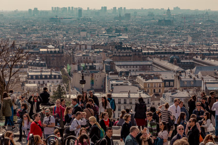 Paris, France, March 26 2017: Tourists admiring the skyline of Paris from the terrace of the Sacre Coeur Basilicaのeditorial素材