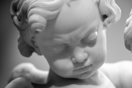 Beautiful marble statue of angel head detailの写真素材