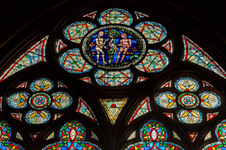 Paris, France, March 27 2017: stained glass window in Notre dame cathedral, Parisのeditorial素材
