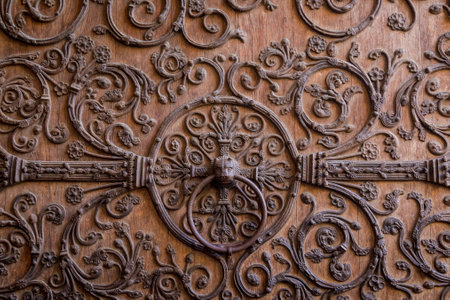 Old wooden door with a metallic pattern close-up. The cathedral Notre-Dame de Parisの写真素材